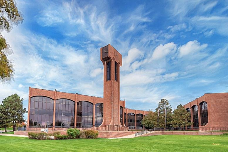 Exterior view of the brick facade and bell tower at 14201, 14291 E 4th Avenue, Aurora (Colorado).