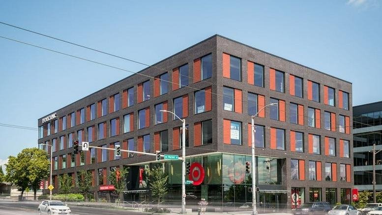 Exterior view of the modern brick facade building at 1448 NW Market St.