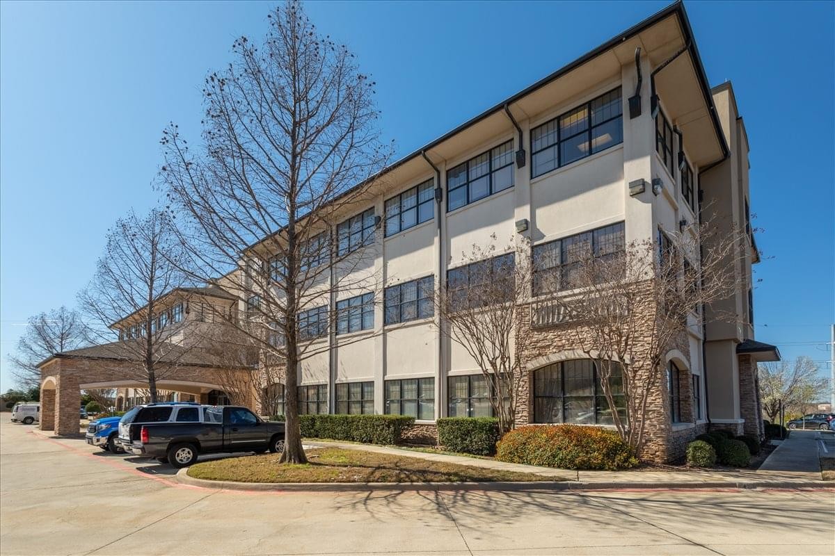 Exterior of the multi-story professional building at 1452 Hughes Road, Suite 200.