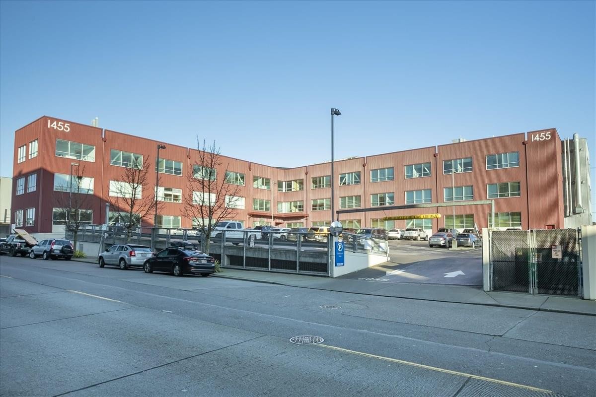 Exterior view of the brick facade building at 1455 NW Leary Way, Suite 400.