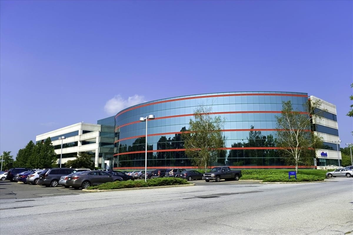 Exterior view of the curved glass-facade 150 Vanderbilt Motor Parkway building.