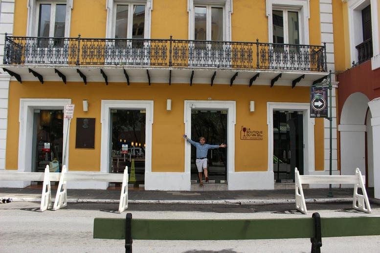 Exterior view of the yellow building with balconies at 151 Calle San Francisco, San Juan, Puerto Rico.