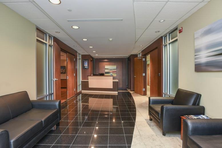 Lobby area at 1521 Concord Pike, Suite 301, Wilmington (Delaware) with black leather seating and polished floors.