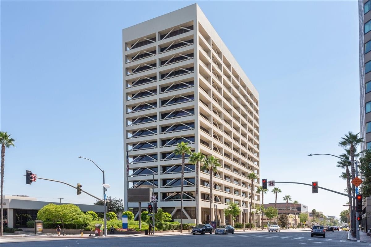 Exterior view of the light-colored high-rise building at 15233 Ventura Boulevard, Suite 500, Galleria.