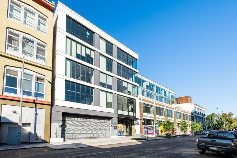 Exterior view of the modern mixed-use building at 1525 11th Avenue.