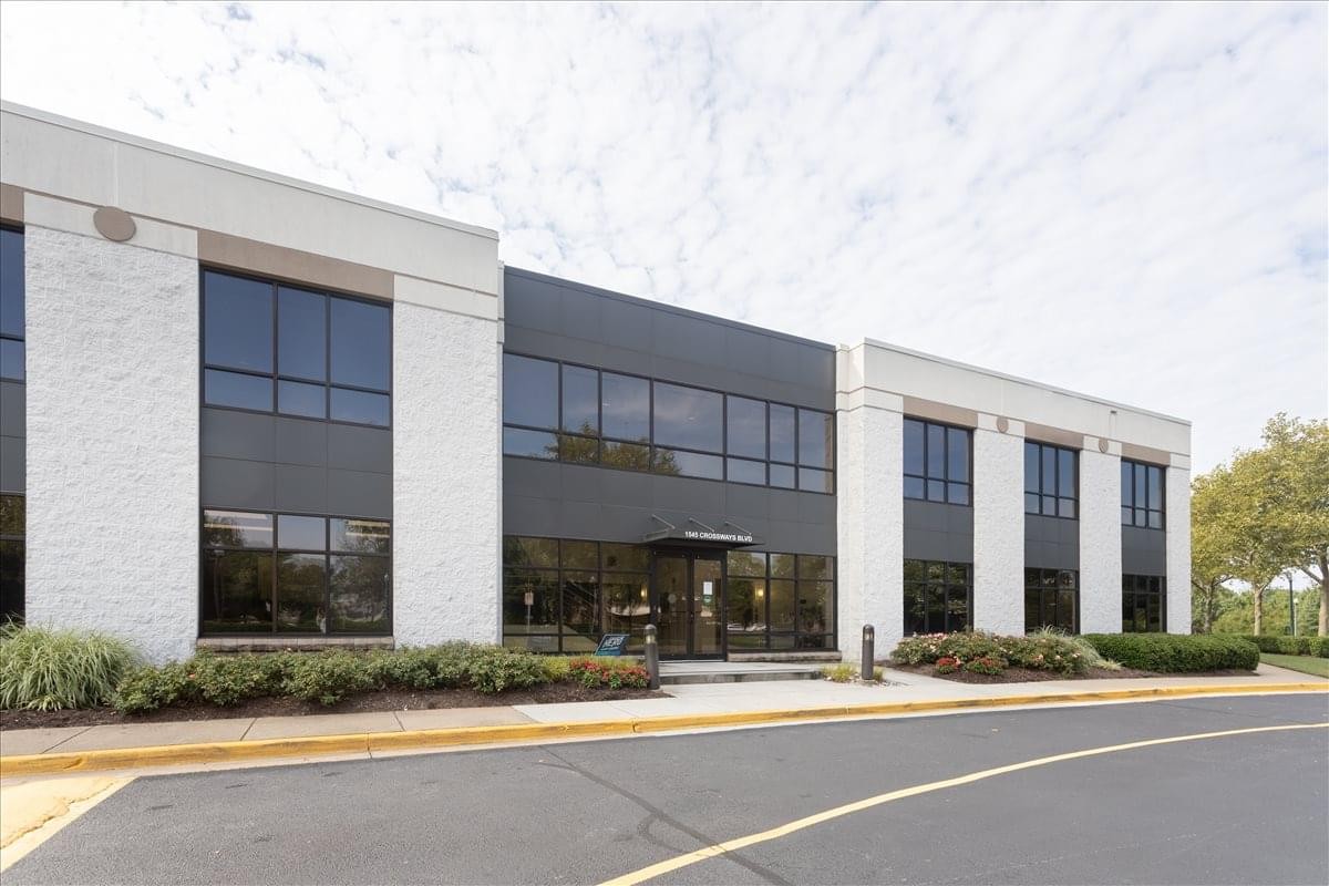Exterior view of the white and charcoal facade of 1545 Crossways Blvd, Suite 250, Chesapeake.
