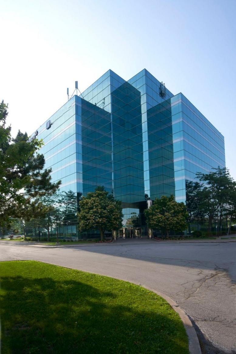 Exterior view of the blue glass-facade building at 1595 16th Avenue, Suite 301.