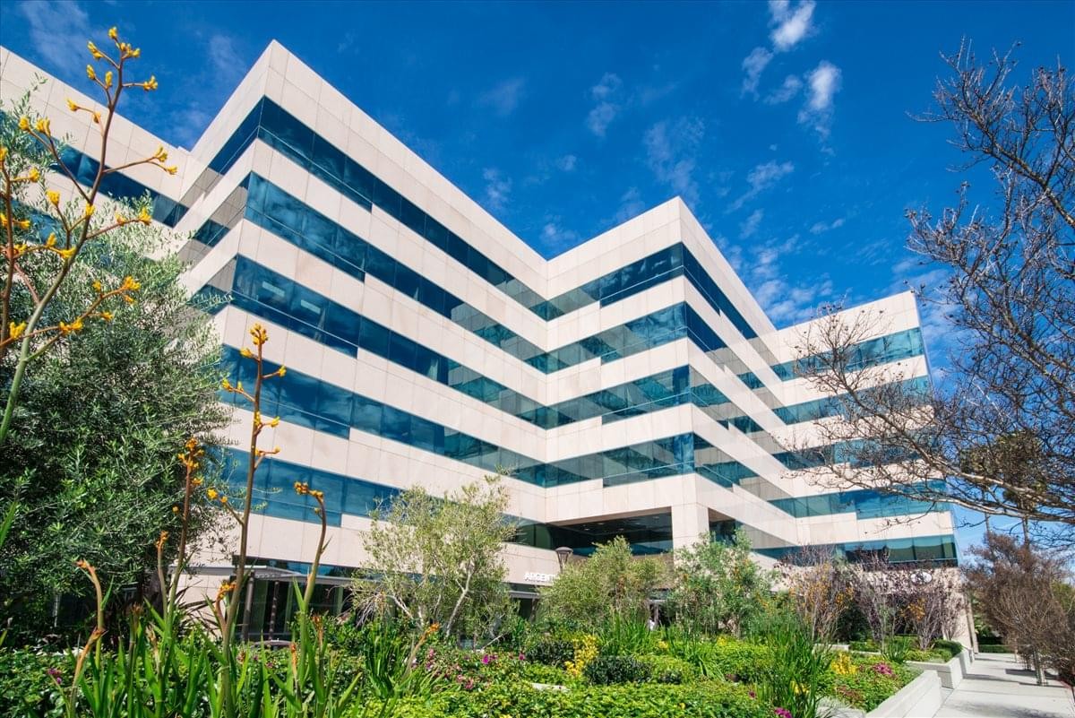 Exterior view of the white and glass multi-story building at 16501 Ventura Blvd.