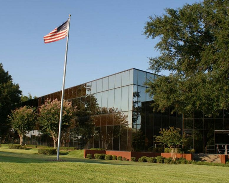 Exterior view of the glass-facade office building at 16770 Imperial Valley Drive.