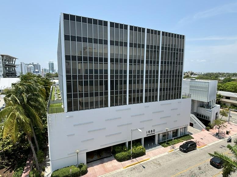 Multi-story glass facade of 1680 Michigan Avenue building.