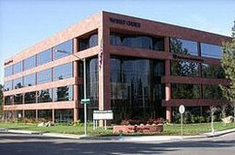 Exterior view of the brick and glass facade at Rancho Bernardo Offices in San Diego.