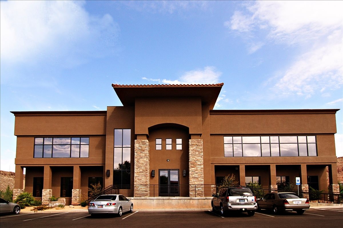 Exterior view of the brown stucco building at 169 West 2710 South Circle, Suite 202, St George, Utah.