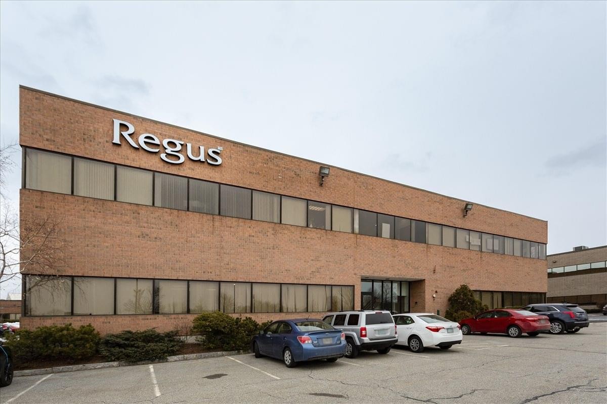 Exterior view of the brick building at 170 Commerce Way, Suite 200 with the Regus logo.