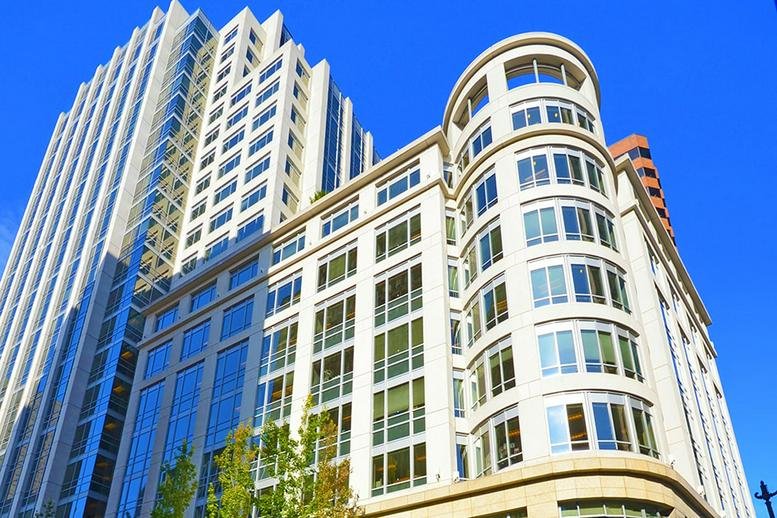 Exterior view of the light-colored facade at 1700 7th Avenue, Suite 2100.