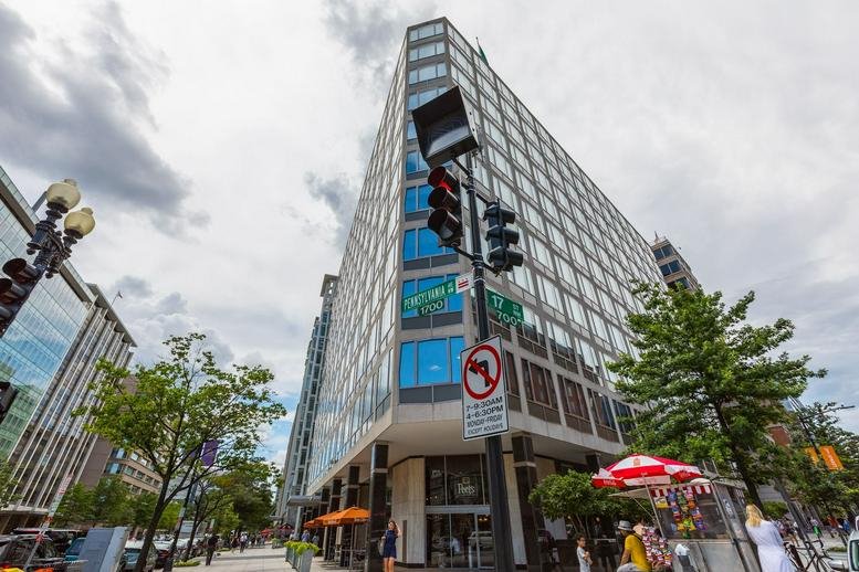 Exterior corner view of the glass office building at 1701 Pennsylvania Avenue NW.