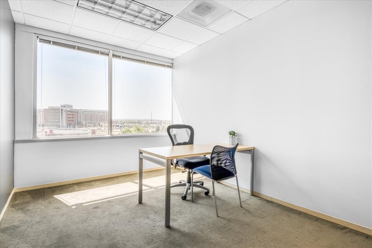 Bright private office at 1745 Shea Center Drive with a window view and ergonomic chair.
