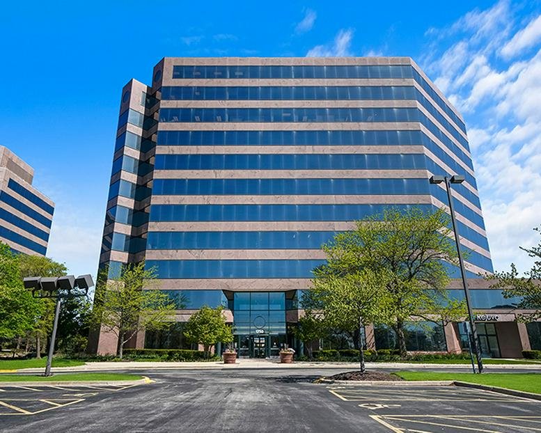 Exterior view of the multi-story glass and stone building at 1750 E Golf Road, Schaumburg, Illinois.