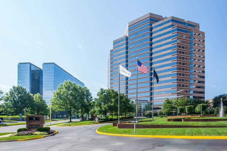 Exterior view of the multi-story glass towers at 1750 Tysons Boulevard.