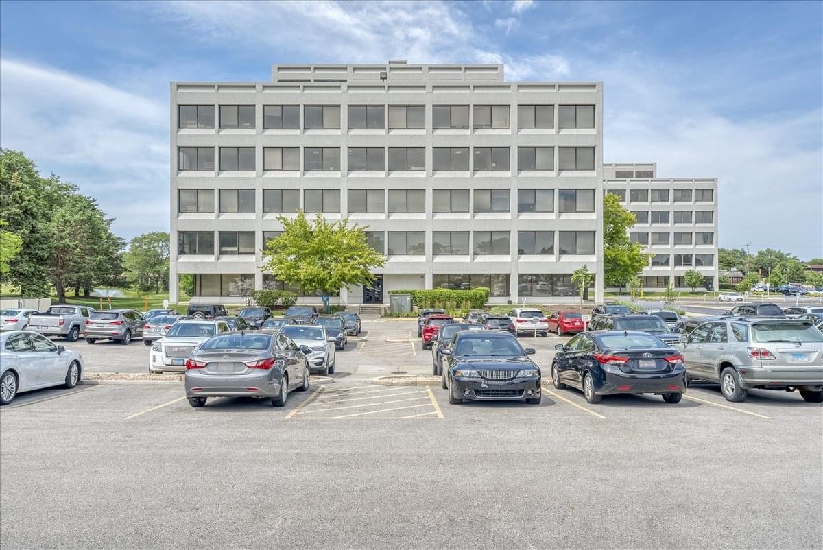 Exterior view of the multi-story 1821 Walden Office Square building and parking lot.