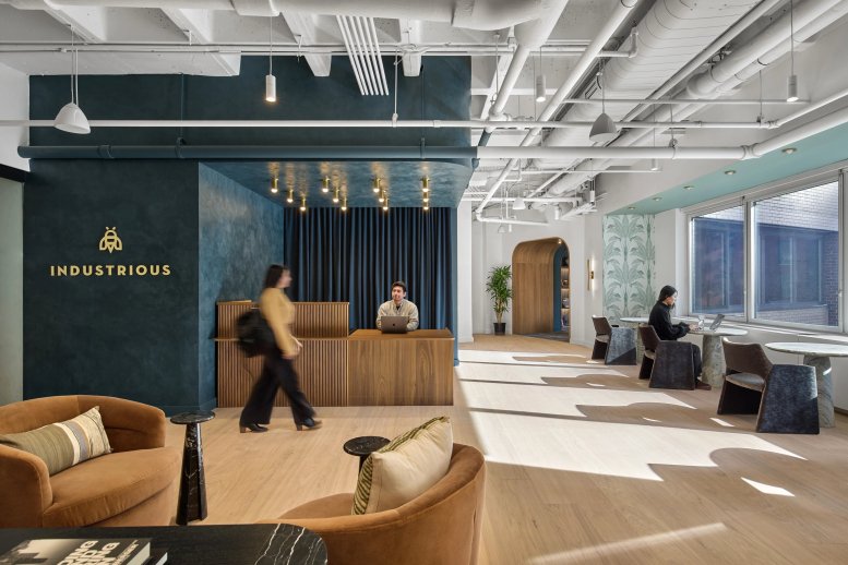 Reception and lobby at 1900 Broadway, 7th Floor, Upper West Side, New York City with blue walls and warm lighting.