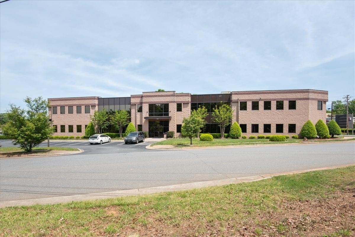 Exterior view of the brick and glass office building at 19109 West Catawba Avenue, 200.