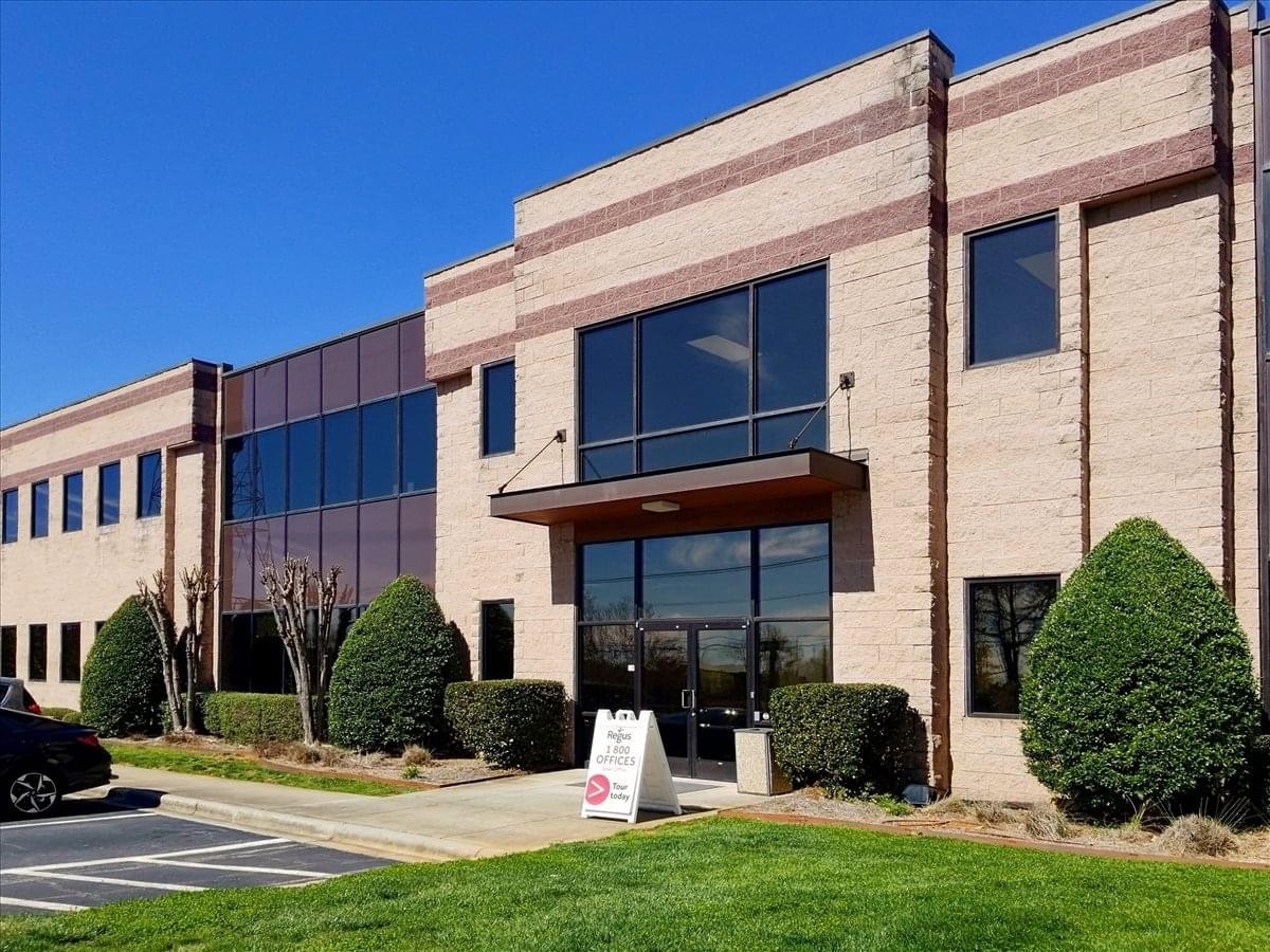 Main entrance to the brick and glass office building.