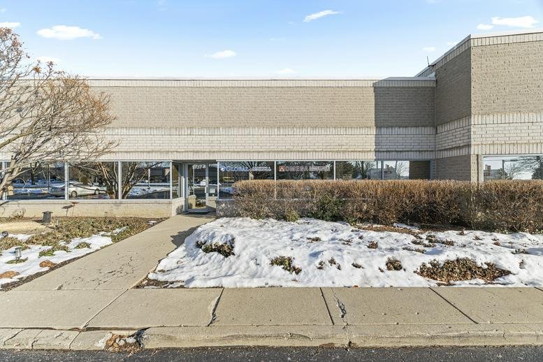 Exterior of the brick and glass industrial facility at 1937 Wright Boulevard.