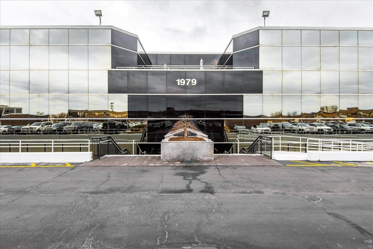 Exterior view of the glass-facade 1979 Marcus Avenue building at Lake Success Center.