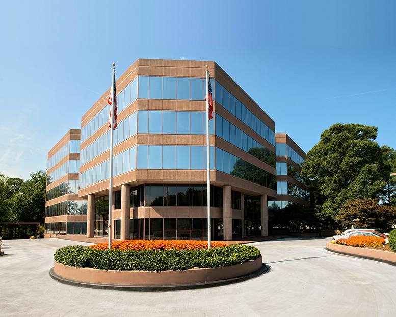 Exterior view of the multi-story brick and glass office building at 1995 North Park Place.