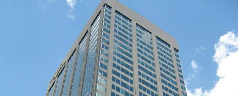 Exterior view of the glass and stone skyscraper at 2 Bloor Street East.