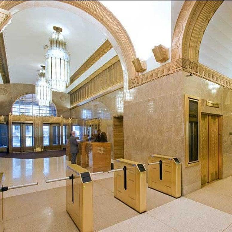 Stately stone facade and grand entrance of 2 Park Avenue, New York.