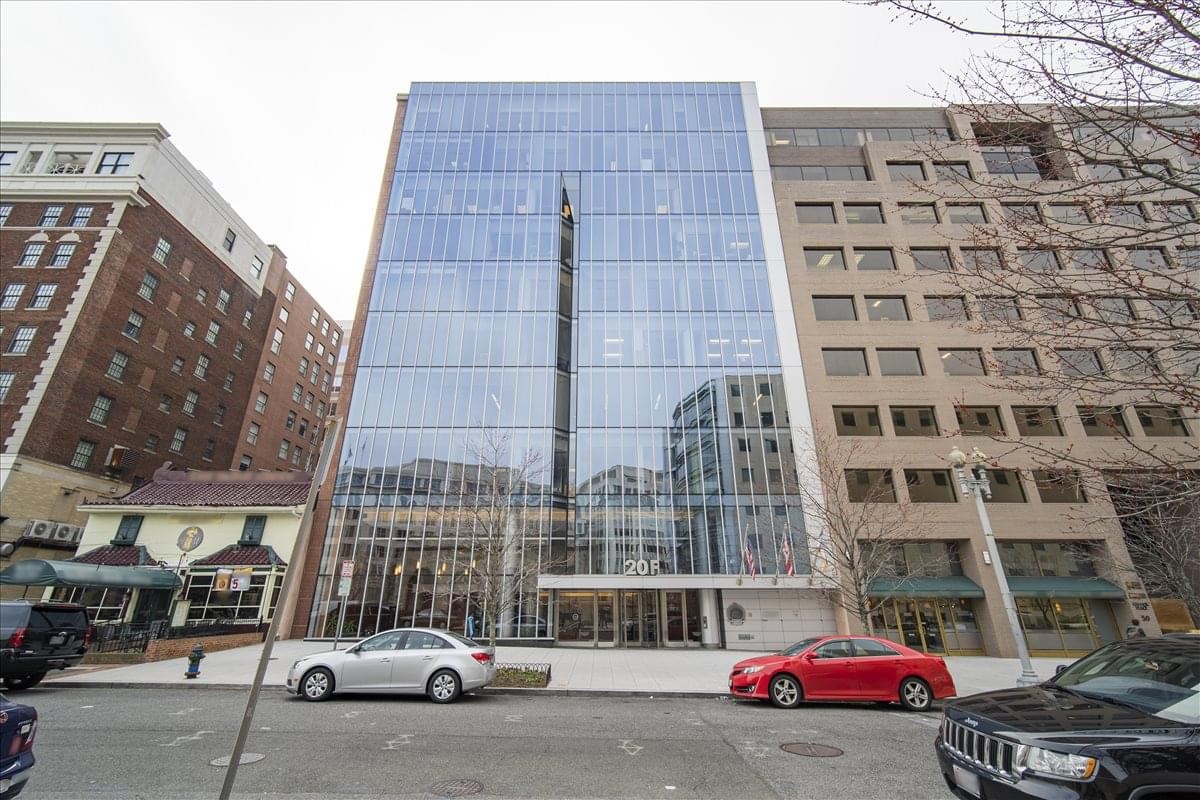 Exterior view of the glass-facade building at 20 F Street NW, 7th Floor, Washington DC.