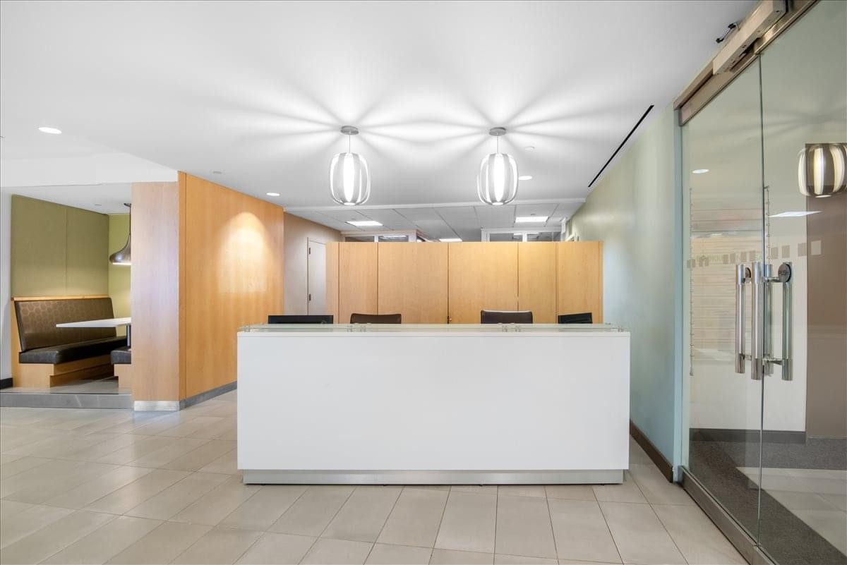 Spacious reception area with a large white desk at the World Financial Centre.