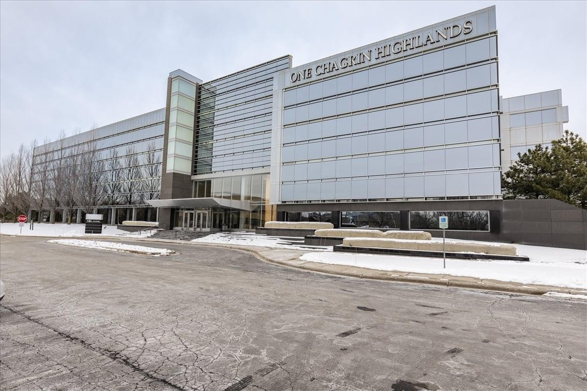 Exterior view of the glass-facade One Chagrin Highlands building with a modern entrance.
