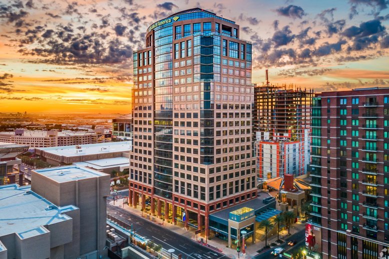 Exterior view of the high-rise building for Indy by Industrious, 201 E Washington Street at sunset.