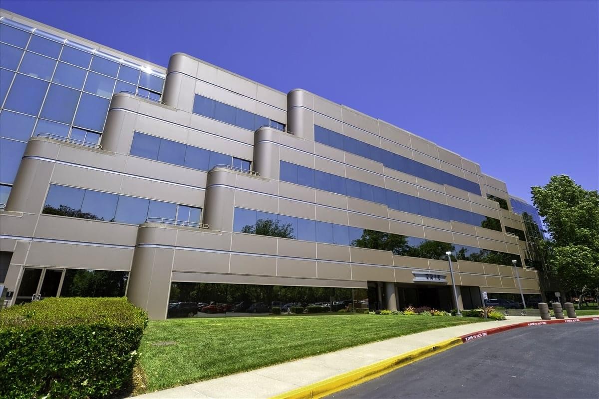 Exterior view of the tiered glass and stone facade at 2010 Crow Canyon Place, Crow Canyon Center.