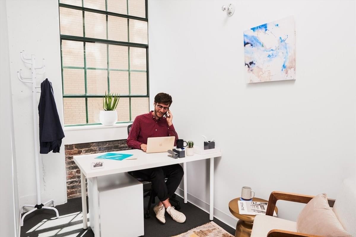 A person working at a desk in a private office at 21 S 11th St, Philadelphia, Pennsylvania.