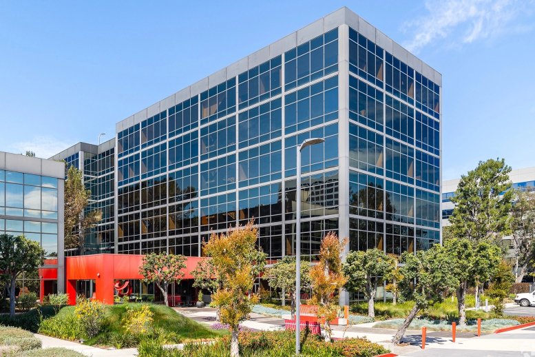 Exterior view of the modern glass-facade building at 2100 East Grand Avenue.