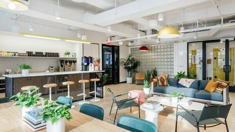 Spacious communal lounge and kitchen area at 214 West 29th Street, New York City.