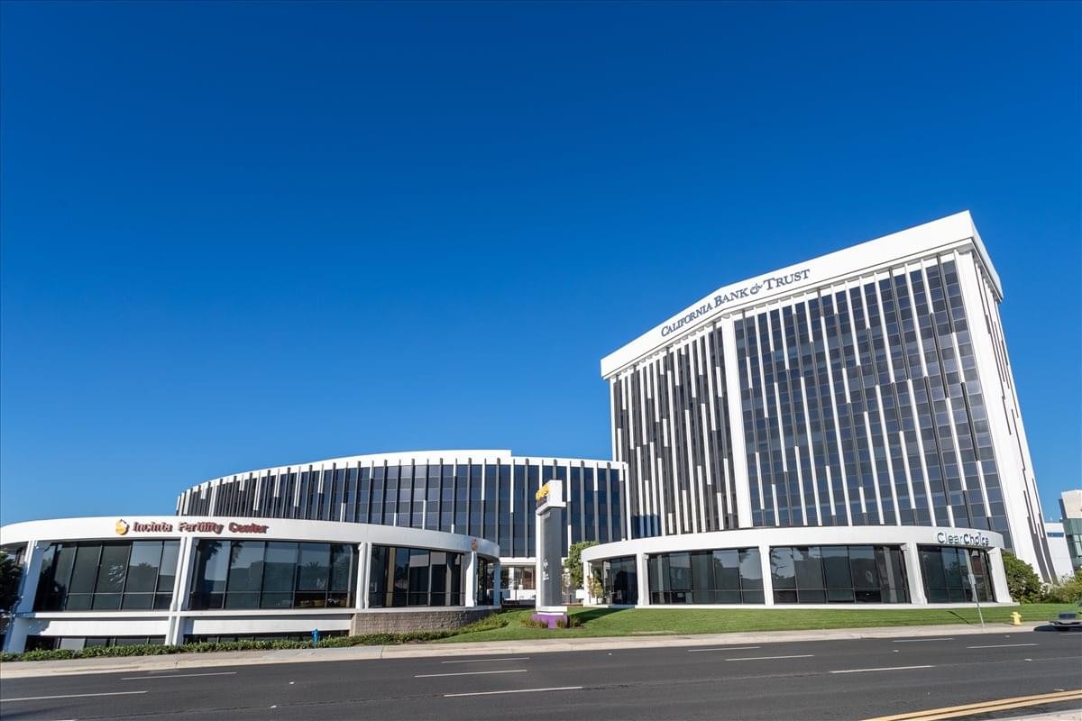 Exterior view of the multi-story Del Amo Financial Centre with its distinctive curved glass facade.