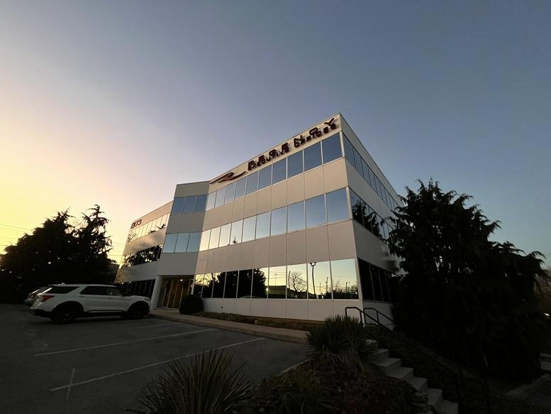 Exterior view of the four-story professional office building at 2173 Embassy Drive.