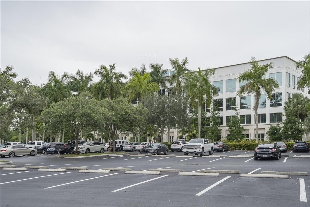 Exterior view of the modern white office building at 2200 N. Commerce Parkway.