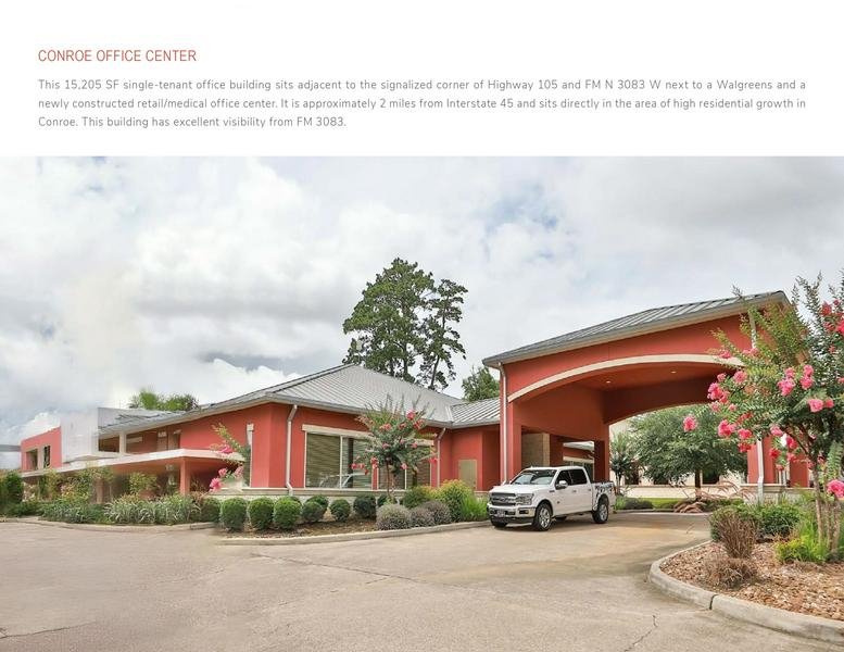 Exterior view of the red-facade Conroe Professional Suites building with a drive-under canopy.