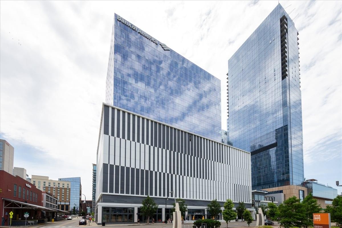 Exterior view of the modern glass-facade tower at 222 Second Avenue, Nashville.