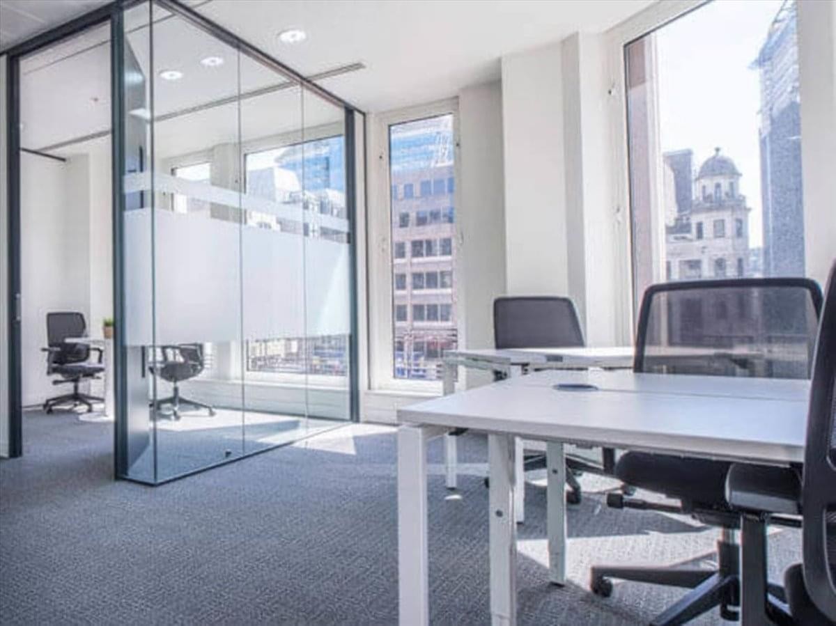 Glass-walled corner office at 2233 Argentia Road, Suite 302, East Tower with urban views.