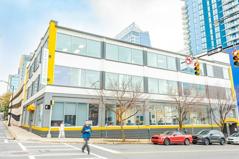 Exterior view of the modern multi-story office building at 227 W. 4th Street.
