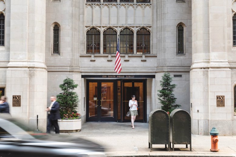 Exterior view of the historic stone facade and main entrance at 230 South Broad Street.