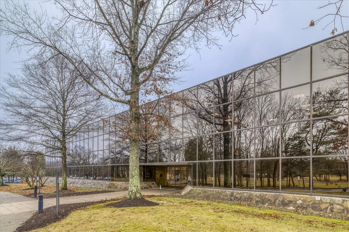 Exterior view of the glass-fronted office building at 233 Mt. Airy Road.