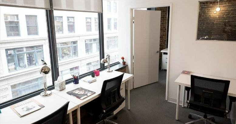 Small private office at 234 5th Avenue with two workstations and city views.