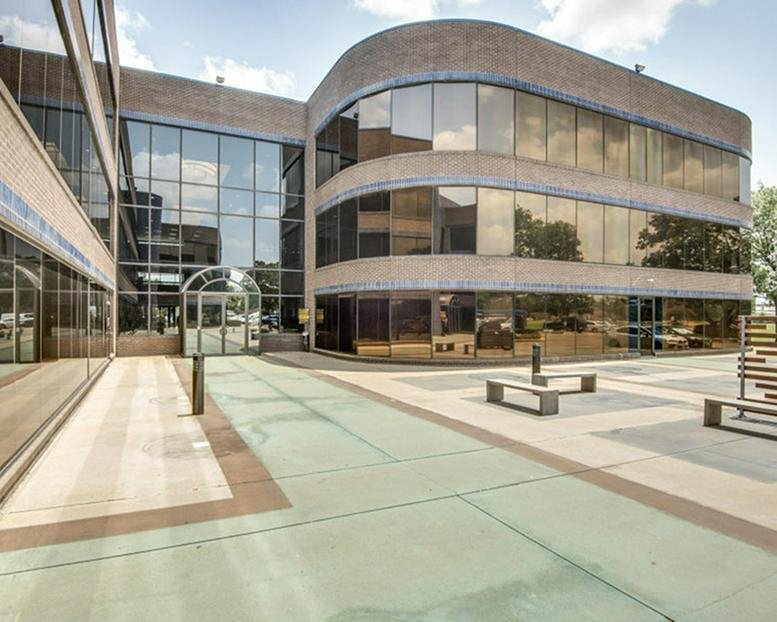 Exterior view of the glass-facade office building at 2351 W Northwest Hwy.
